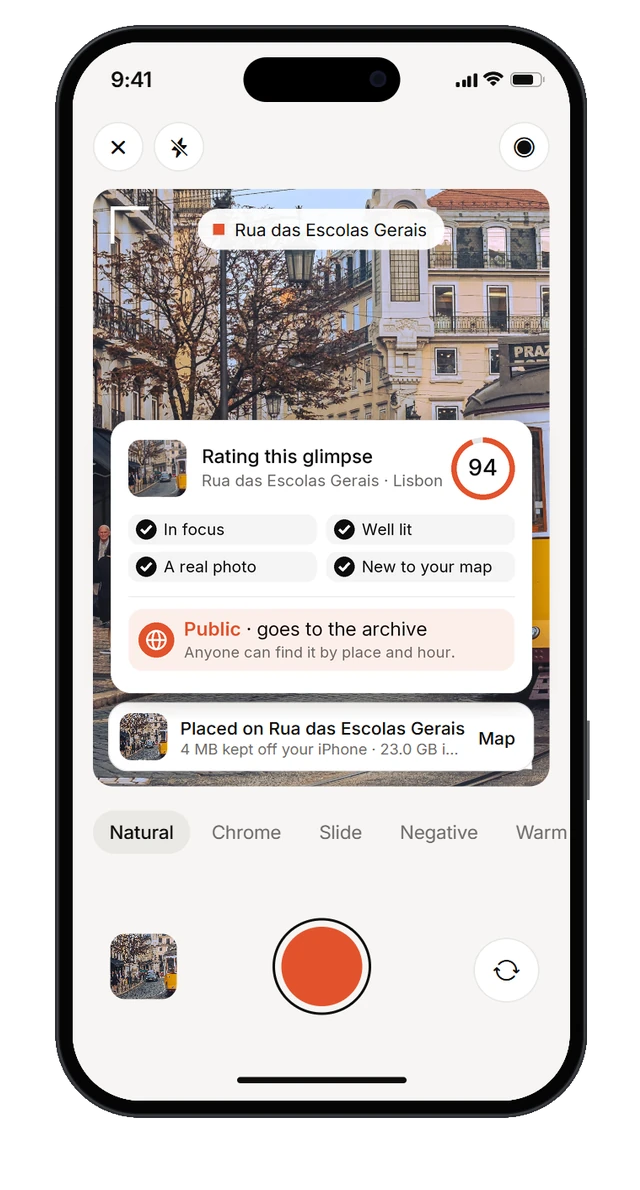 Right after a shot: the photo is rated 94, in focus, well lit, a real photo and new to your map, so it goes public to the archive; placed on Rua das Escolas Gerais, 4 MB kept off your iPhone